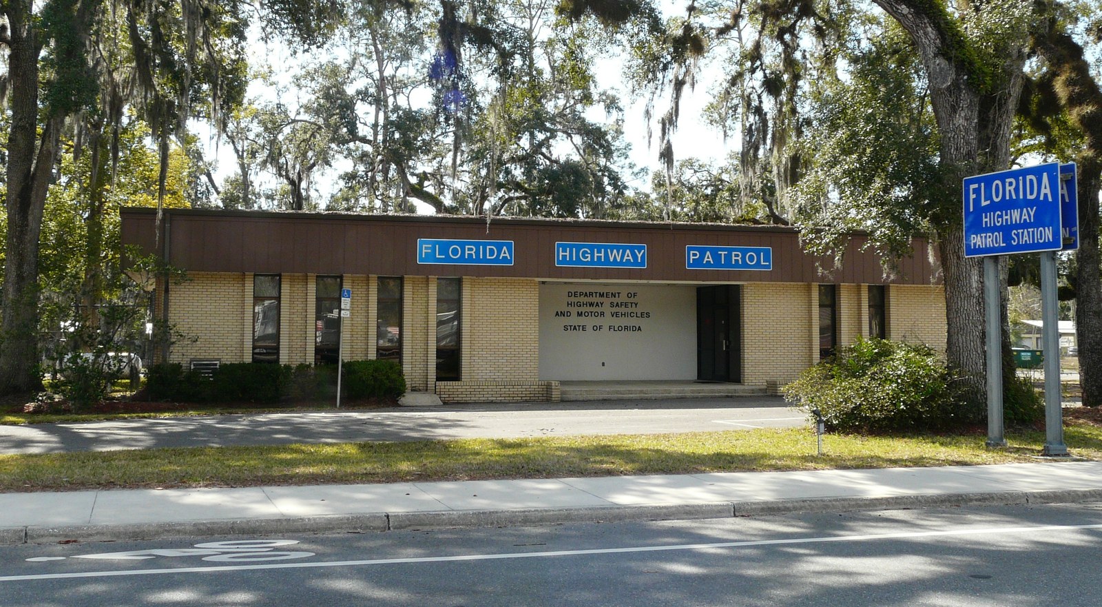 Exterior of a Florida Highway Patrol station in Cross City, Florida, marked with Department of Highway Safety and Motor Vehicles signage — the agency that administers underage DUI license suspensions under F.S. 322.2616.